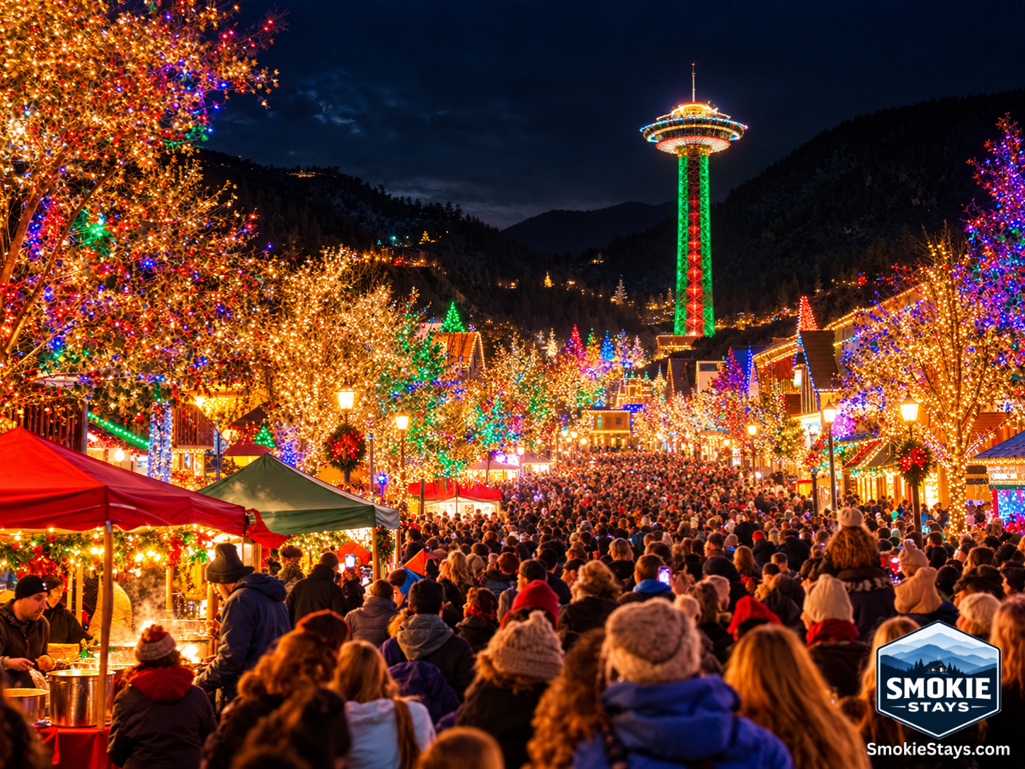 Over a million LED lights switch on simultaneously across downtown Gatlinburg during the Winter Magic Kickoff illumination ceremony, with tens of thousands of people filling the Parkway, chili vendor tents glowing in the foreground, and the illuminated Sp